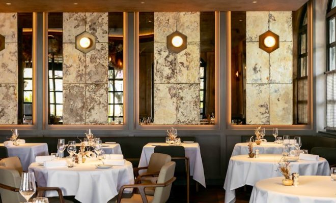 high end restaurant, tables, wine glasses, mirrors